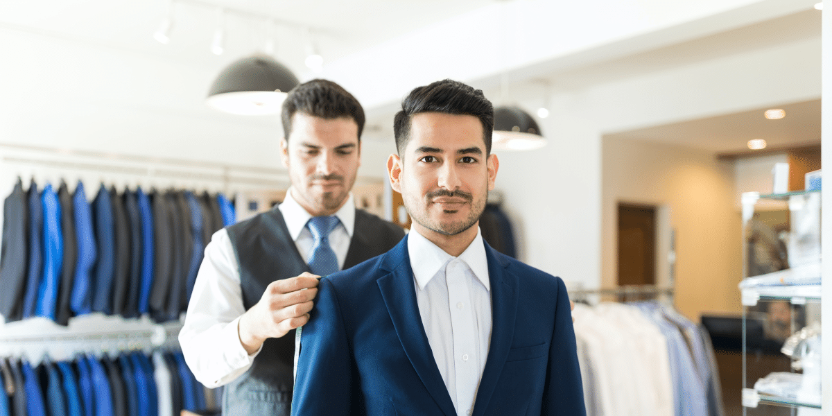 Image commercially licensed from https://unsplash.com/photos/tailor-taking-back-measurements-of-good-looking-client-in-order-to-make-new-suit-at-shop-39JLBA66wVk